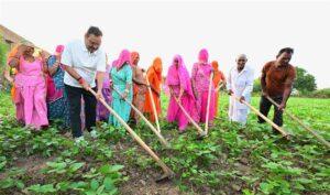 Rajasthan CM Bhajanlal Sharma interacting with farmers and planting a sapling in Tilanesh village, Nagaur